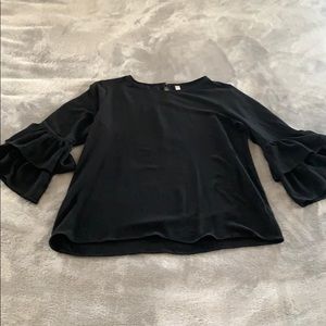 Black long sleeved, ruffled shirt